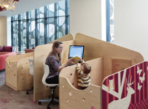 Fairfield library furniture with caregiver and child