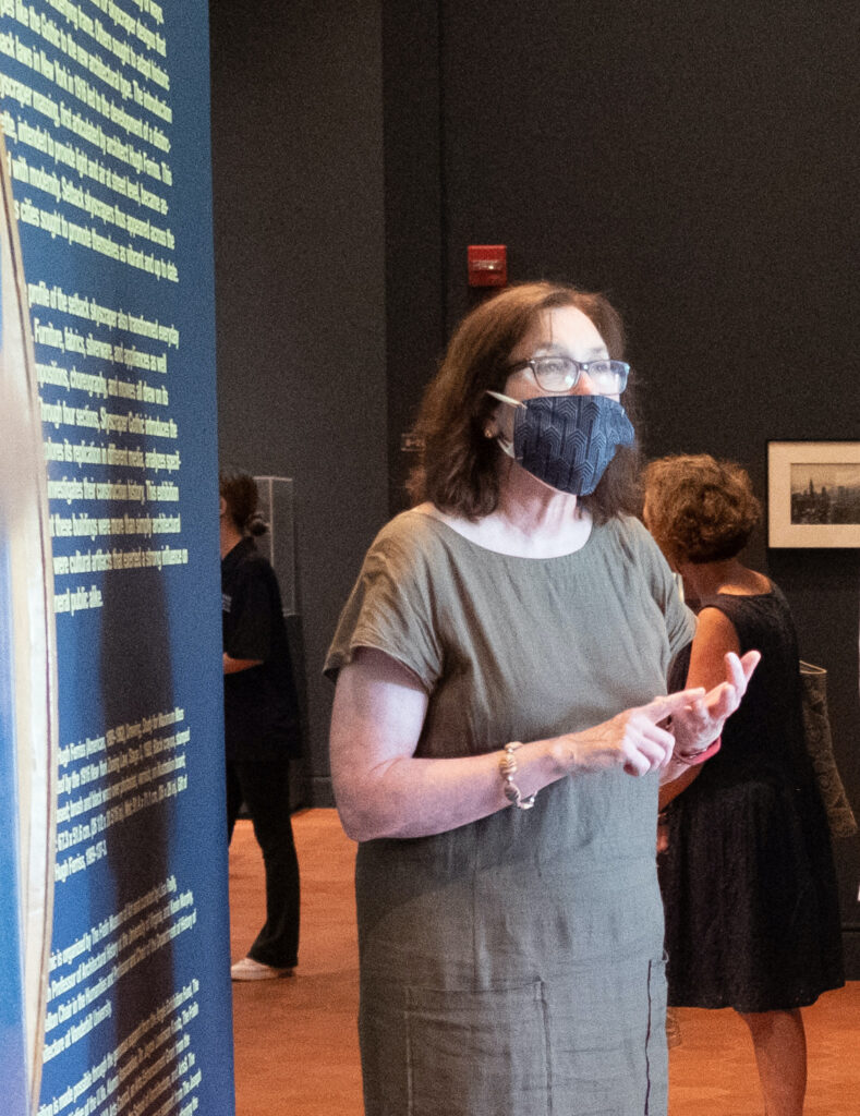 A masked Lisa Reilly at the opening of the exhibition Skyscraper Gothic