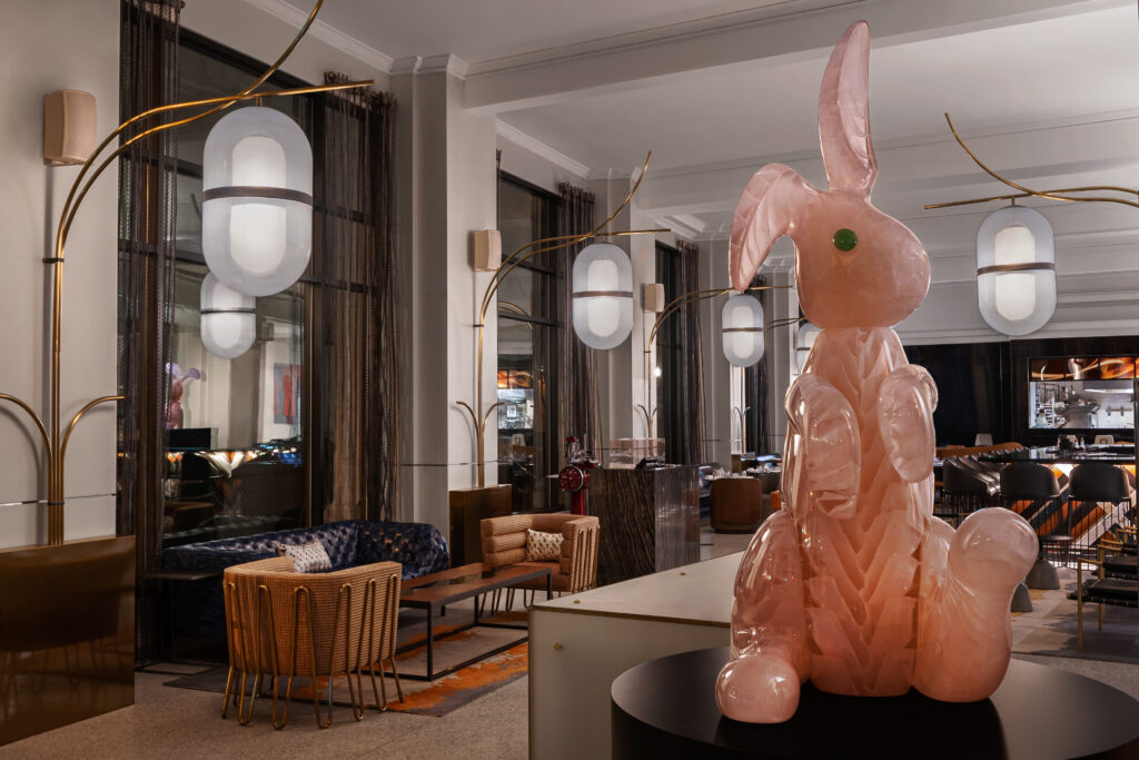 pink glass rabbit in a hotel lobby