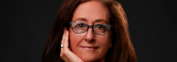 Photo of architect Lori Garrett against a dark background